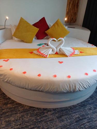 a bed with two beds with hearts on it at Ibis Styles La Louvière in La Louvière