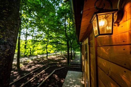 a building with a light on the side of it at Tiny House - Gilda e i suoi amici in Neive