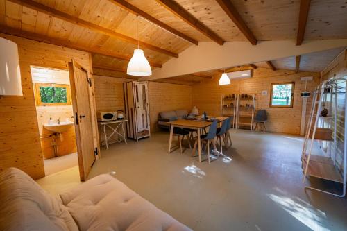 a living room with a couch and a table at Tiny House - Gilda e i suoi amici in Neive