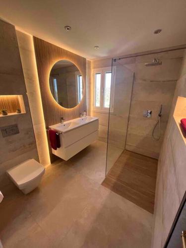 a bathroom with a sink and a toilet and a shower at Villa with HEATED Pool and Amazing Mountain and Sea Views No Young Groups Allowed in Mojácar