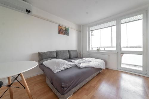 A bed or beds in a room at AR Rezidencia Ludmanská