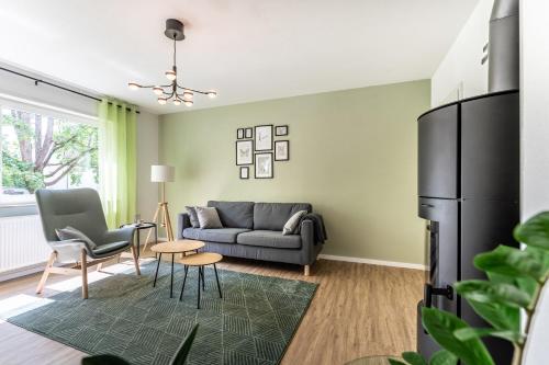 a living room with a couch and a table at City-Luxus Apartment Rottweil in Rottweil