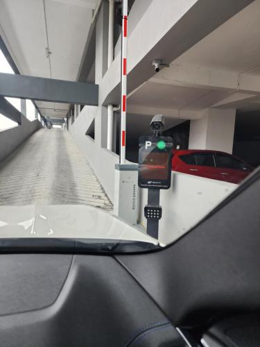 a car parked in a parking lot with a parking meter at The Netizen #Cheras#C180#MRT#9person stay#Staycation 3 Bed Rooms in Cheras