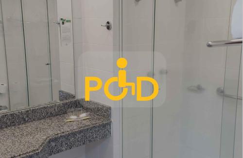 a bathroom with a shower with aptic sign on it at Master Express Alberto Bins - 200 metros do Hospital Santa Casa in Porto Alegre