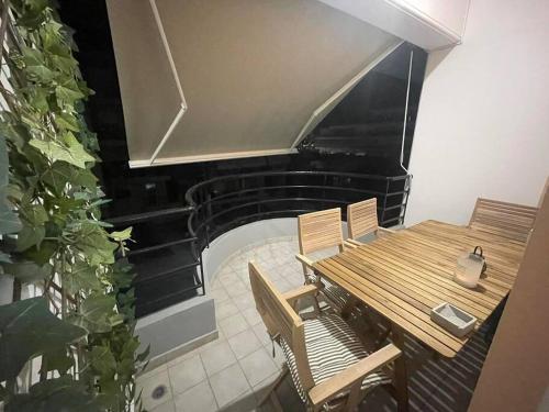 an overhead view of a table and chairs and a piano at Serenity apartment in Pýrgos