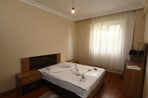 Ένα ή περισσότερα κρεβάτια σε δωμάτιο στο Sarot Thermal Vadi Tatil Koyu - Halal Hotel