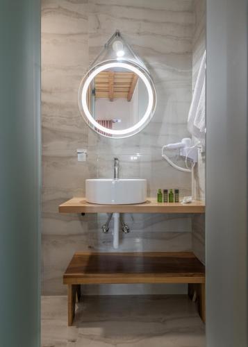 a bathroom with a sink and a mirror at Milion Fantasy House in Adamas
