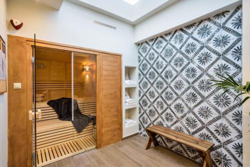 a room with a sauna with a bench at City Haven Apartment in Chania Town
