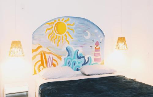 a bedroom with a bed with a painting on the wall at Sea Wolf Hostel - Lagoa da Conceição in Florianópolis