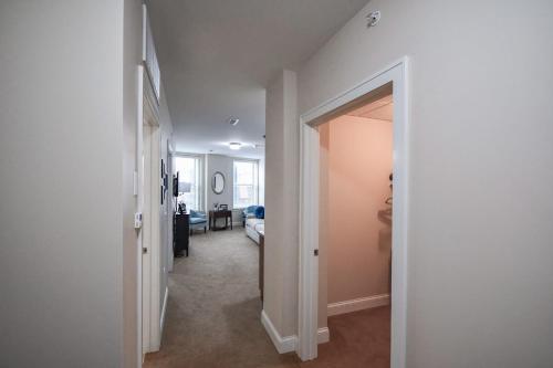 a hallway with a hallway leading to a bedroom at Stay at the Historic Inman in Champaign