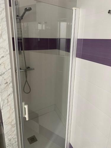 a shower with a glass door in a bathroom at CASA BAIONA CENTRO in Baiona