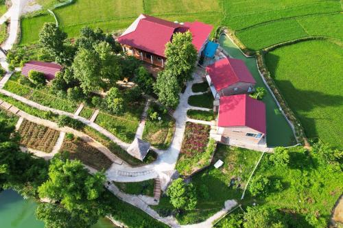 an aerial view of a house with a yard at Riverside Homestay in Cao Bằng