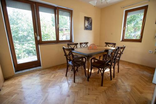 a dining room with a table and chairs at Crystal in Ohrid