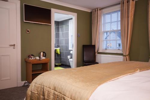 Katil atau katil-katil dalam bilik di 34 Argyle Guesthouse