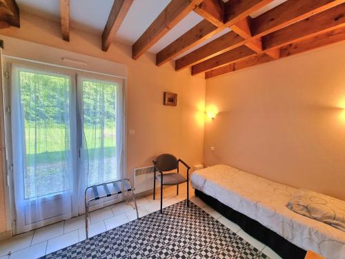 Кровать или кровати в номере Auberge de la Forêt