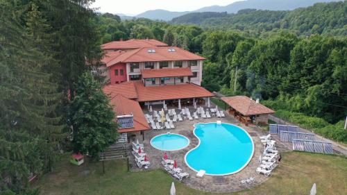 an aerial view of a house with a swimming pool at Vidima Apartment Hotel in Apriltsi