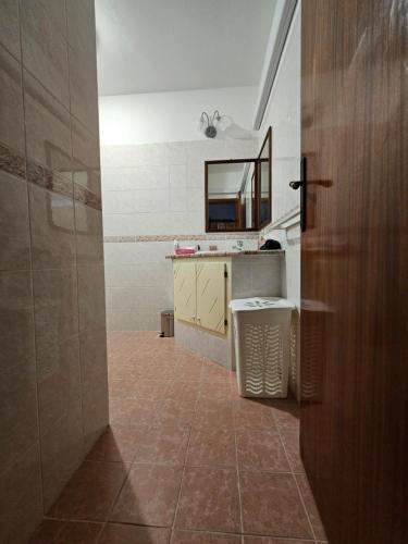 a bathroom with a sink and a mirror at Casa Li Conchi in Arzachena