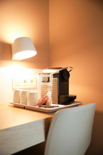a toaster oven sitting on top of a counter at Alfa Inn in Blankenberge