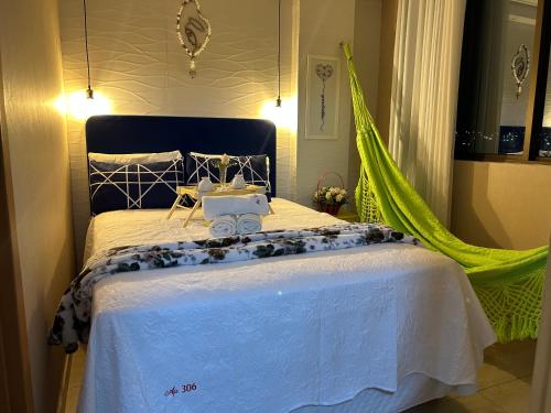 Ein Bett oder Betten in einem Zimmer der Unterkunft Maravilhoso local para aproveitar e descansar
