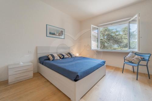 Un pat sau paturi într-o cameră la A Casa di Massi - Goelba