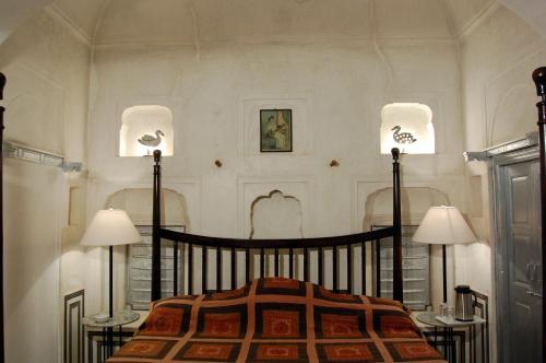 Ліжко або ліжка в номері Hotel Chobdar Haveli