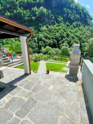 a stone patio with a view of a mountain at Rustico Chiara in Sonogno
