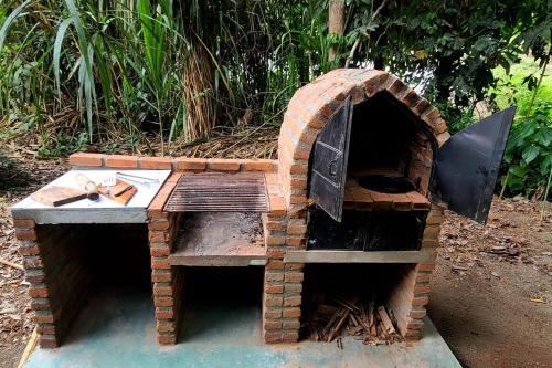 a brick oven sitting on top of a table at Rio Escondido in Minca