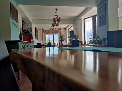 a living room with a table and a dining room at Inspire View - Boutique in Bran