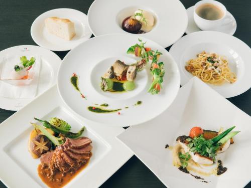 a group of plates of food on a table at Showcase Hotel KASANE in Gotsu