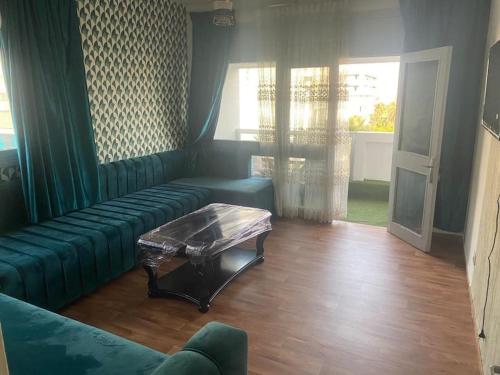 a living room with a couch and a coffee table at Appartement Corniche Nador in Nador