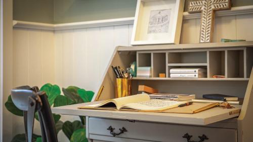 a desk with a book on top of it at Soma Trentham in Trentham