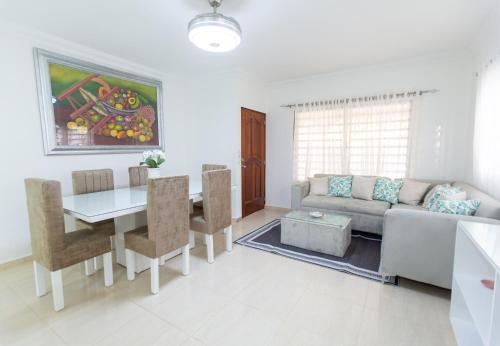 a living room with a couch and a table at MB Apartment - A in San Felipe de Puerto Plata
