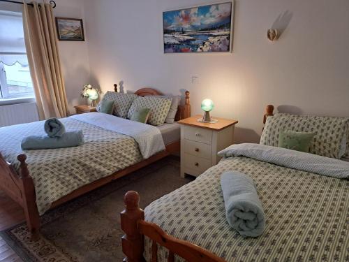 Postel nebo postele na pokoji v ubytování Coreen Guest House