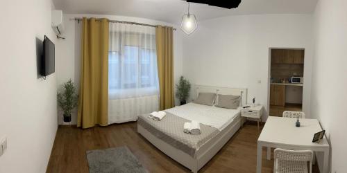 Ένα ή περισσότερα κρεβάτια σε δωμάτιο στο Vila RAA Huși