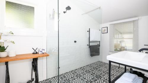 a bathroom with a shower and a sink at Casa Merenda Daylesford in Daylesford
