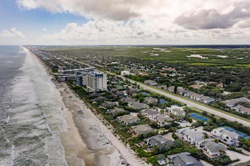 an aerial view of a beach with condos at Sea Woods 3 Bedroom 2 Bath in New Smyrna Beach