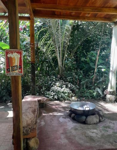 an outdoor area with a metal bowl on top of rocks at The Temple II, Mindo in Mindo