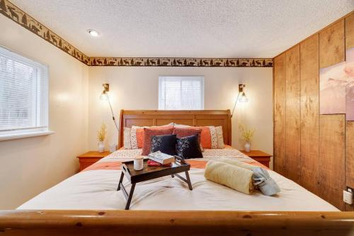 a bedroom with a large bed with a wooden headboard at Woodland Escape-0.6Mile to Lake Beach Pet Friendly in Lake Harmony