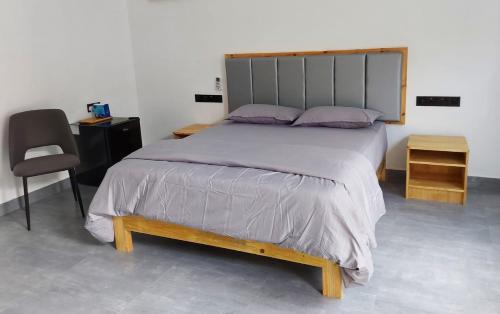 A bed or beds in a room at Fehi Velaa Stay