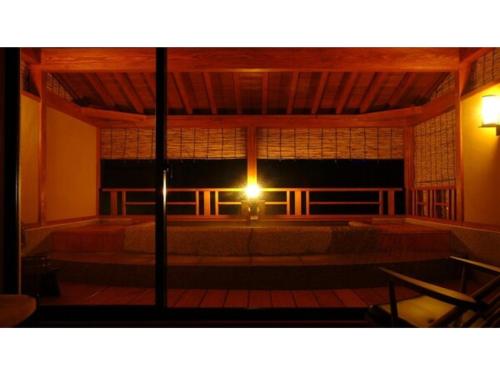 a room with a stage with a light in it at Yumura Onsen Tomiya - Vacation STAY 81727v in Shinonsen