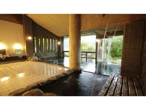 a large room with a pool of water at Yumura Onsen Tomiya - Vacation STAY 81718v in Yumura