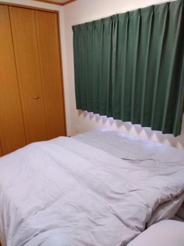 Кровать или кровати в номере Restful Tsukuda - Vacation STAY 14830