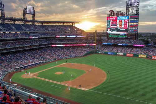 a baseball game in a stadium at sunset at Family Fun South Philly Game House Near Sports Stadiums and Concerts in Philadelphia