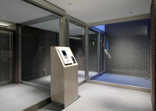 an elevator in a building with glass windows at Urban Grace Hiroshima 1301 - Vacation STAY 14847 in Hiroshima