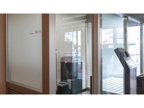a glass door of a building with a balcony at Matto Terminal Hotel - Vacation STAY 98887v in Hakusan