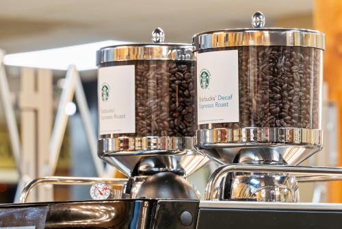 two containers of coffee beans sitting on top of a coffee machine at Thousand Hills Resort Hotel in Branson