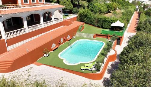 an overhead view of a house with a swimming pool at High Villa in Alenquer