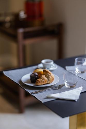 a plate of food on top of a table at Palazzo Murat Luxury Rooms in Arienzo San Felice