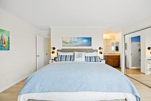 En eller flere senge i et værelse på Beach Retreat