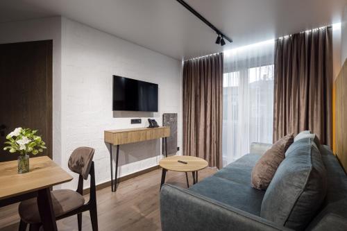 a living room with a couch and a table at Apartel Uzhhorod in Uzhhorod